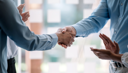 People shaking hands after a meeting